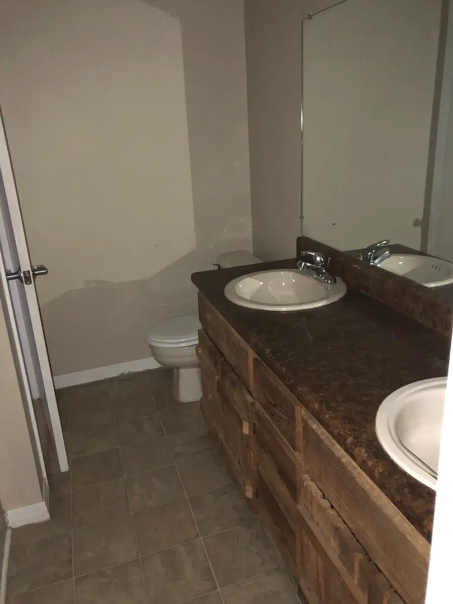 Full bathroom with a double-sink vanity