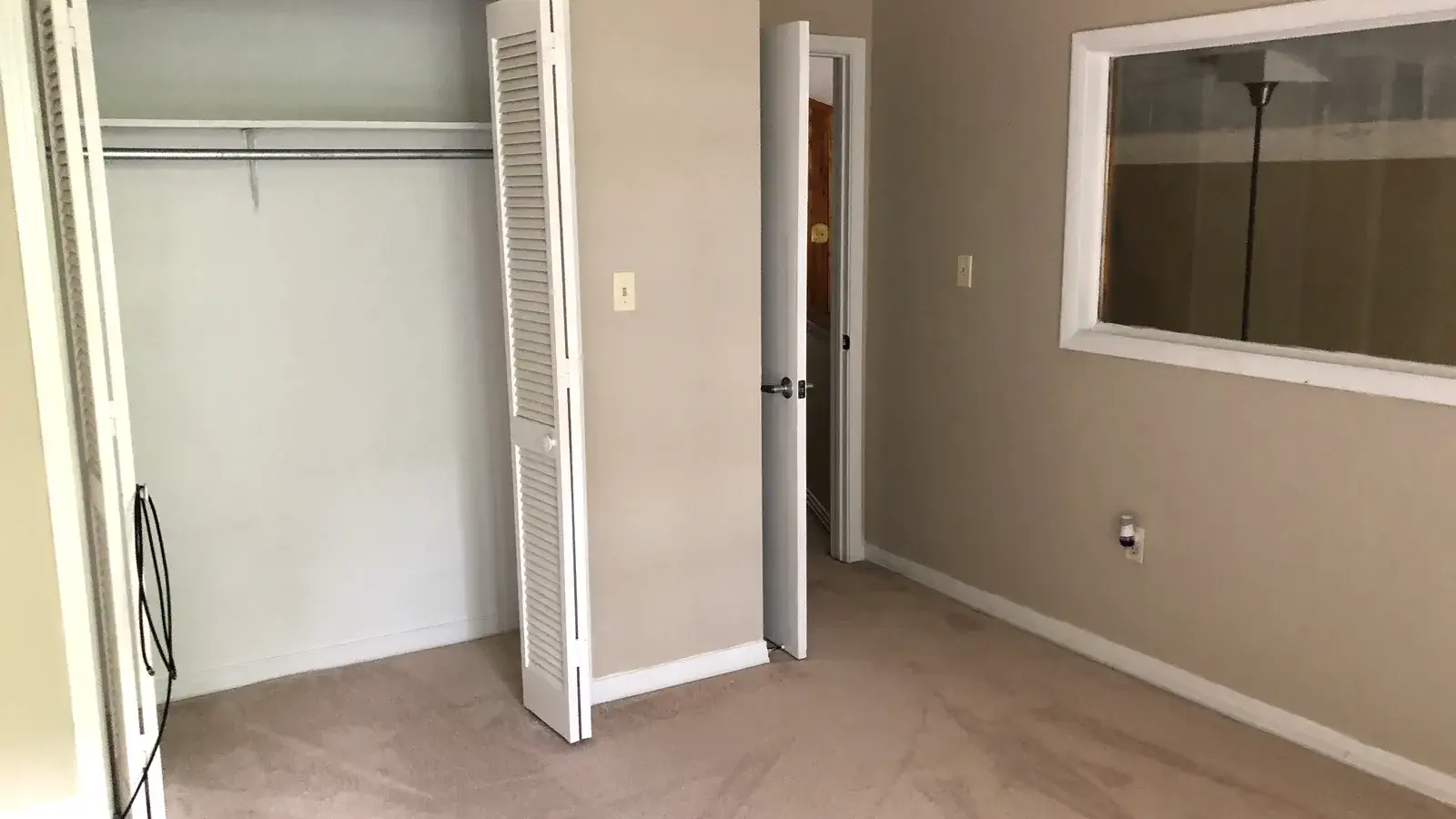 Guest bedroom with closet, looking back toward the upstairs hallway