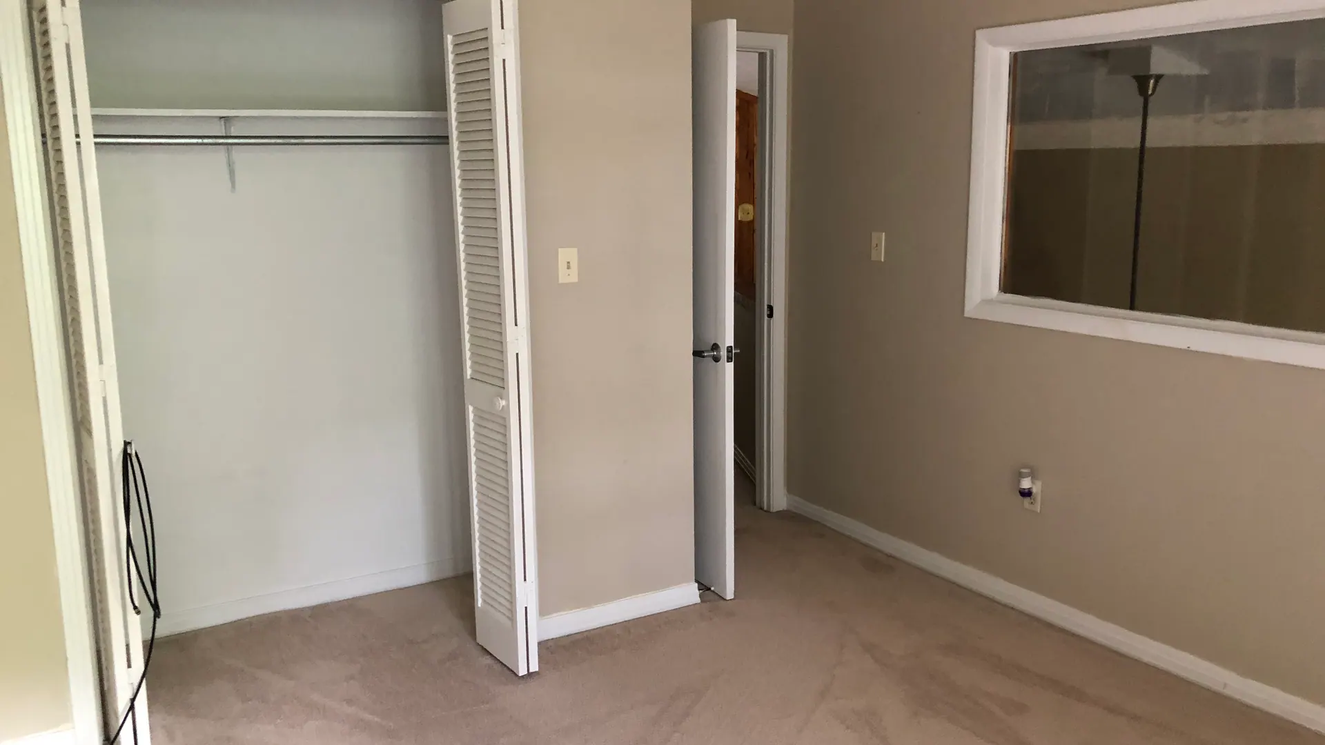 Guest bedroom with closet, looking back toward the upstairs hallway